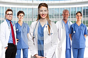 Smiling doctor in front of her medical team