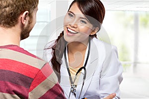 Smiling doctor giving a consultation to a patient in her medical