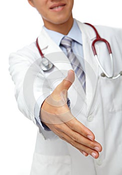 Smiling doctor giving hand for handshaking