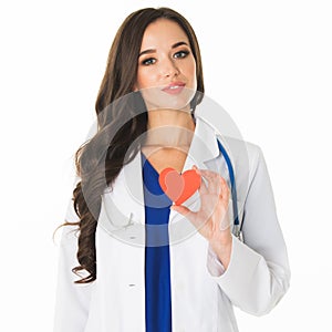 Smiling doctor holding heart paper