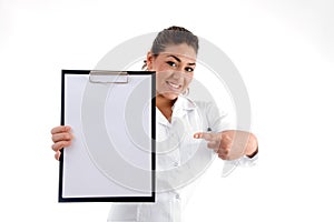 Smiling doctor indicating the writing board