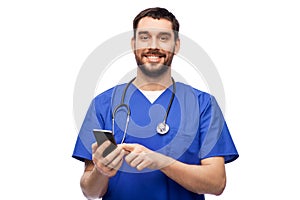 smiling doctor or male nurse using smartphone