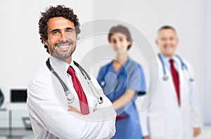 Smiling doctor portrait with his team