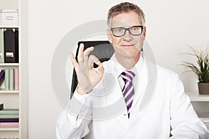 Smiling Doctor Showing Okay Hand Sign