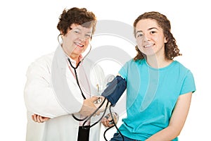 Smiling Doctor and Teen Patient