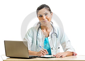 Smiling doctor working at laptop isolated