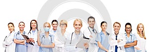 Smiling doctors and nurses with tablet pc