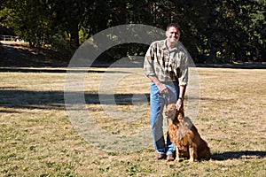 Smiling Dog Owner at Park