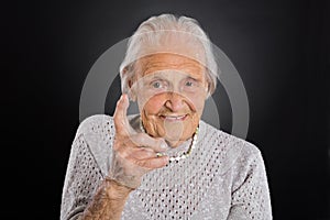 Smiling Elder Woman Waving Her Finger