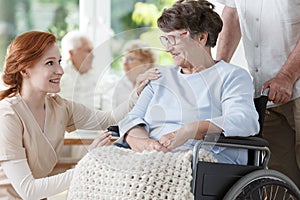 Smiling elder woman on wheelchair photo