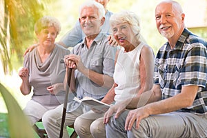 Smiling elderly people at patio