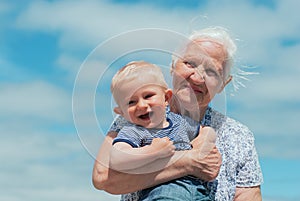 Elderly woman with a baby
