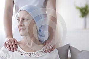 Smiling elderly woman with cancer