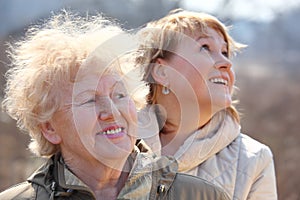 Smiling elderly woman and her daughter