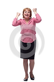 Smiling elderly woman keeping arms raised and looking up while standing isolated on white background