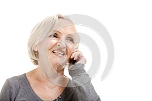 Smiling Elderly Woman Speaks on the Phone