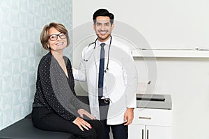 Smiling Elderly Woman Visiting Family Doctor