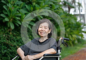 smiling elderly woman on wheelchair