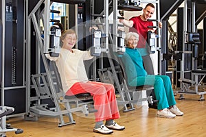 Smiling Elderly Women at the Gym with Instructor