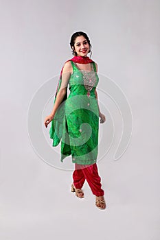 Smiling Elegant Model In Salwar Kameez Posing In Front Of The Camera photo