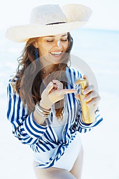 smiling elegant woman on ocean shore