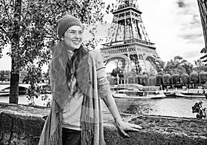 Smiling elegant woman tourist having excursion in Paris, France