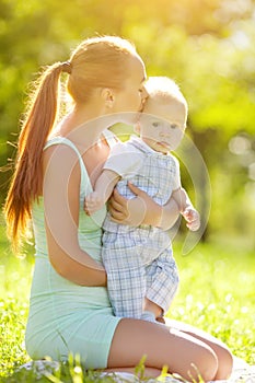 Smiling emotional kid with mum on a walk. Smile of a child