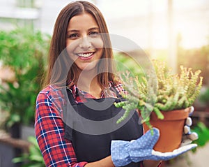 Smiling employee at a flower nursery