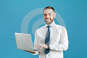 Smiling enterprising manager with laptop