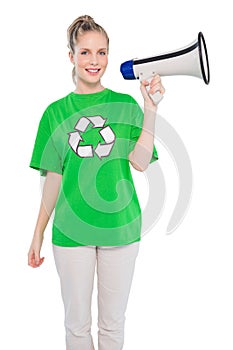 Smiling environmental activist holding megaphone