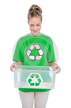 Smiling environmental activist holding recycling box photo