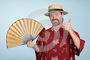 Smiling european in traditional chinese shirt