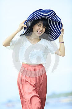 smiling face of happiness woman relaxing on sea beach