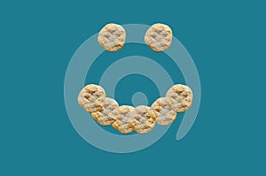 Smiling face shape with ramadan pitas on a turquoise background