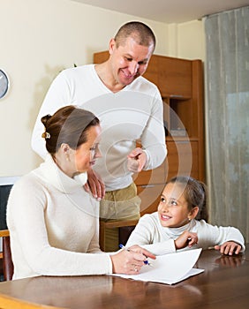 Smiling family with documents