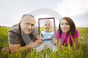 Smiling family through frame