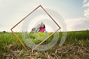 Smiling family through frame