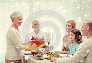 Smiling family having holiday dinner at home