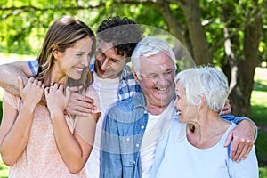 Smiling family hugging