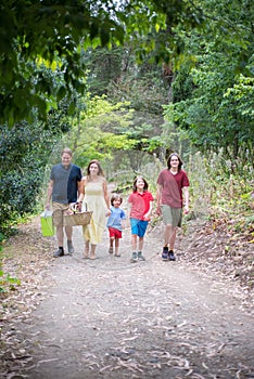 Smiling family walking in park