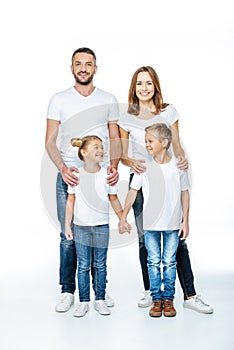 Smiling family in white t-shirts