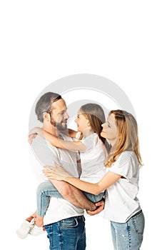 Smiling family in white t-shirts