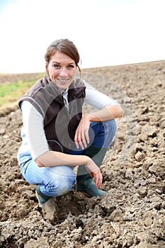 Smiling farmer woman in the fileds