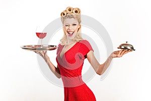 Smiling fashionable pinup girl. Perfect makeup and hairstyle. Beauty trends. Beautiful blonde woman in red dress.