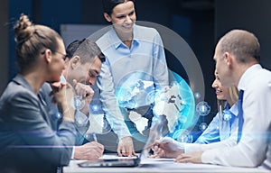 Smiling female boss talking to business team