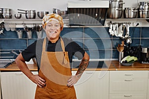 Smiling Female Chef in Kitchen