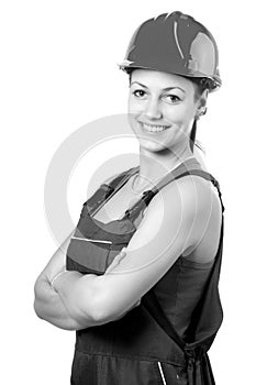 Smiling female construction worker isolated on white