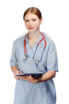 Smiling female doctor in blue surgical coat with red stethoscope