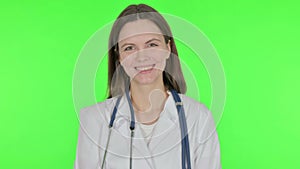 Smiling Female Doctor on Green Background