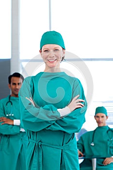 Smiling female doctor with her team